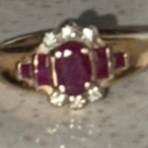 Gold Ring with Red Gemstone and Diamond Accents